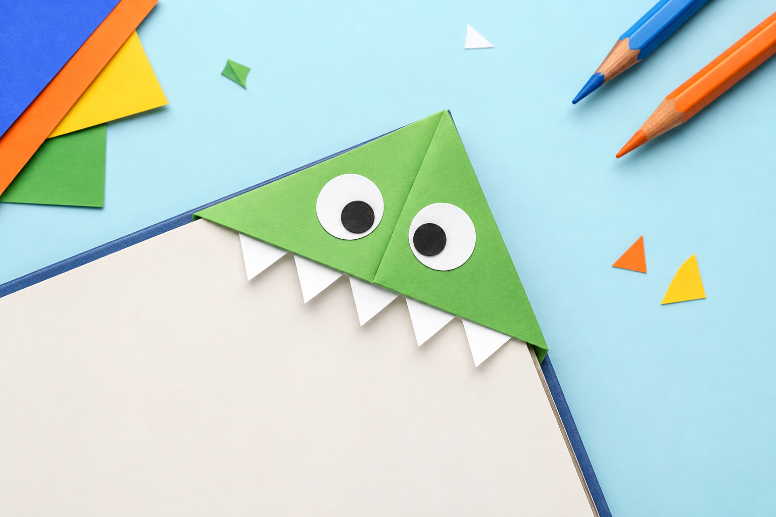 Voorbeeld van een monster tussen je bladzijden, gemaakt van gekleurd papier