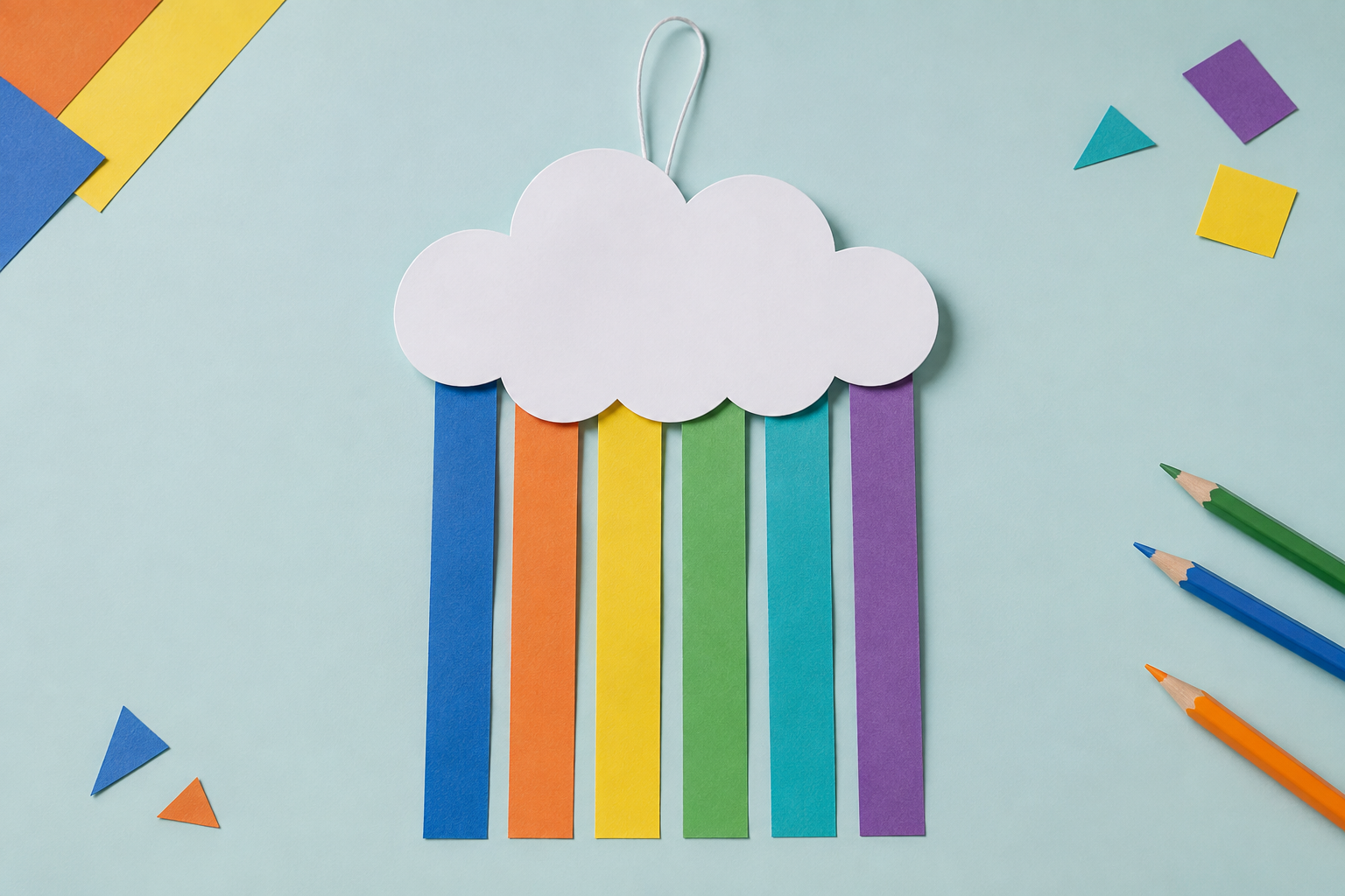 Voorbeeld van een wolk met regenbooglinten, gemaakt van gekleurd papier